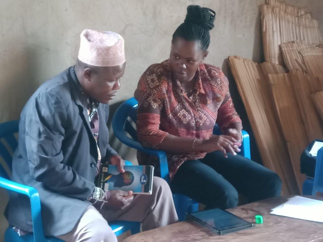Enumerator conducting the token-based elicitation with a farmer