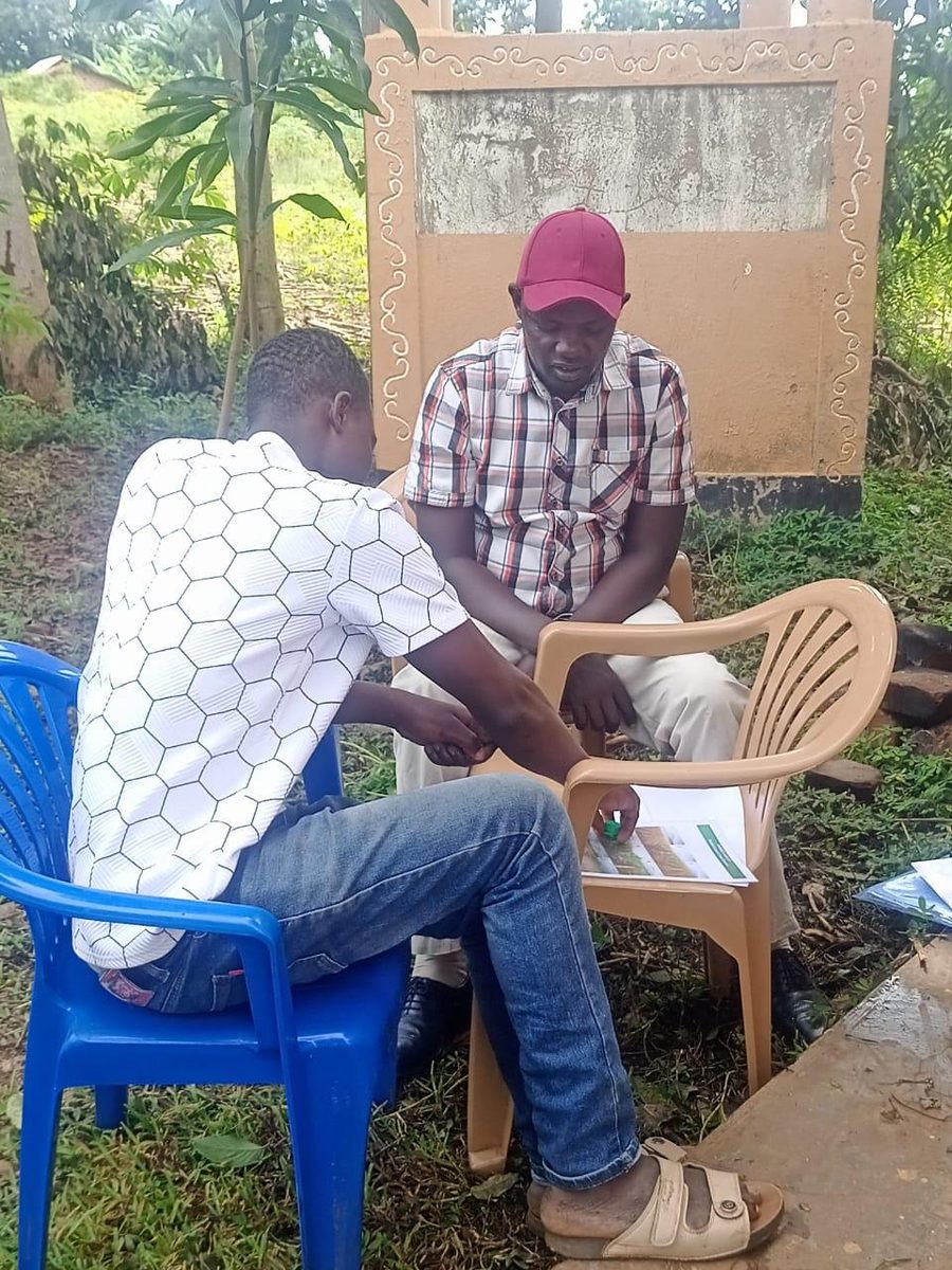 Enumerator and farmer during the survey